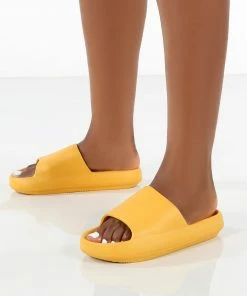 Public Desire UK Flex Yellow Rubber Flat Sliders