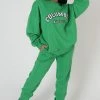 Public Desire UK Oversized Columbia Slogan Sweatshirt Green
